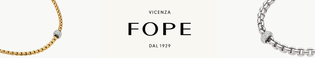 FOPE Logo in center with "DAL 1929" below and "VECENZA" above logo. On the right is a gold think chain with diamonds in centre, left is silver chain the same