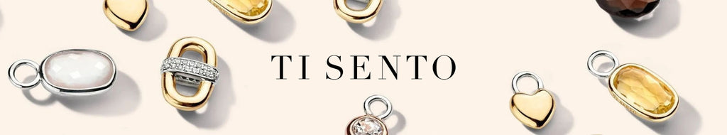 Ti Sento Logo with background of precious stones and pendant charms