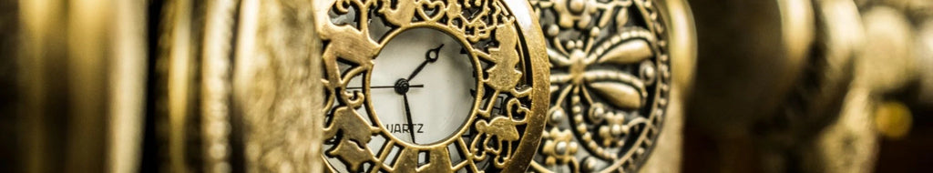 Close up of a row of pocket watches focused on one