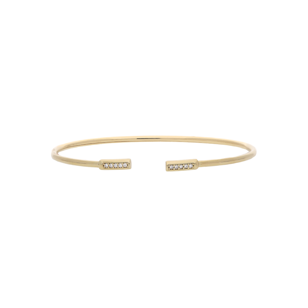 Gold bracelet with small diamonds on a white background
