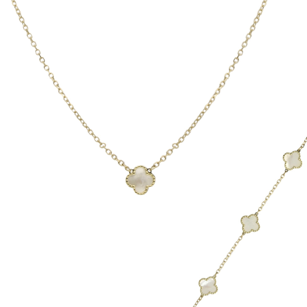 Delicate gold necklace with a mother of pearl clover paired with a gold chain bracelet with three mother of pearl clovers on a white background
