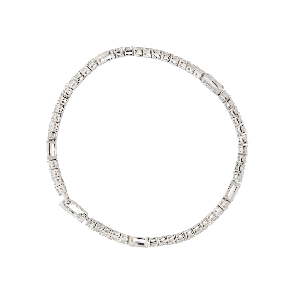 Silver bracelet with square-cut stones and brilliant-cut stones on a white background