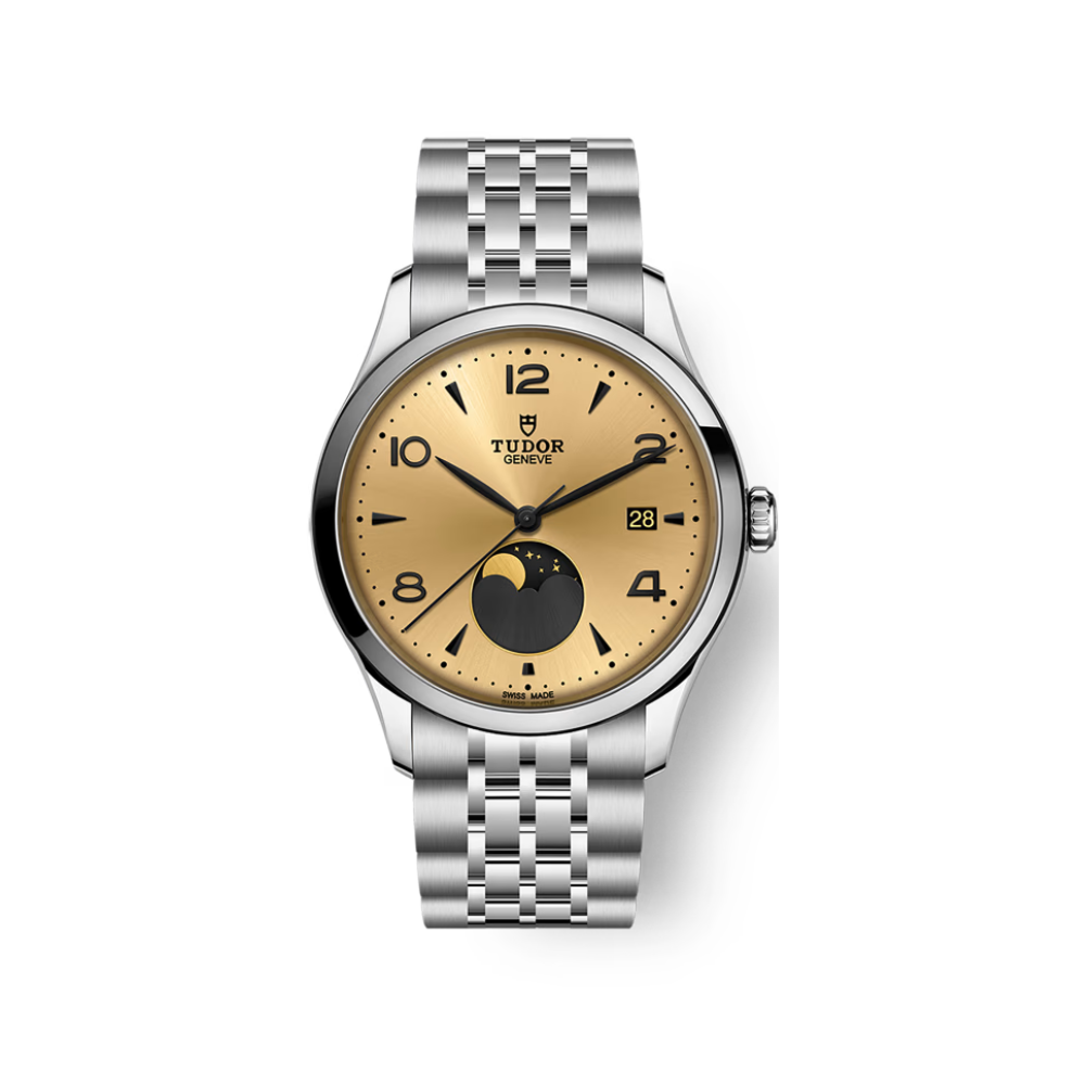 Tudor watch with gold face and steel bracelet on a white background